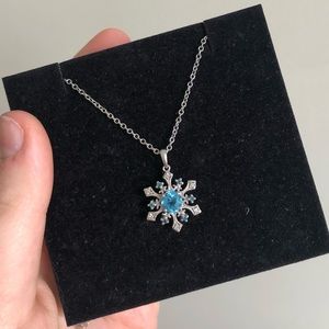 Blue topaz snowflake pendant in sterling silver